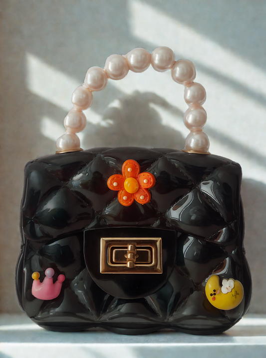 Silicon pearl sling bag with golden chain strap and pearl handle – stylish and durable mini shoulder bag for girls and women in black, available online in India.

