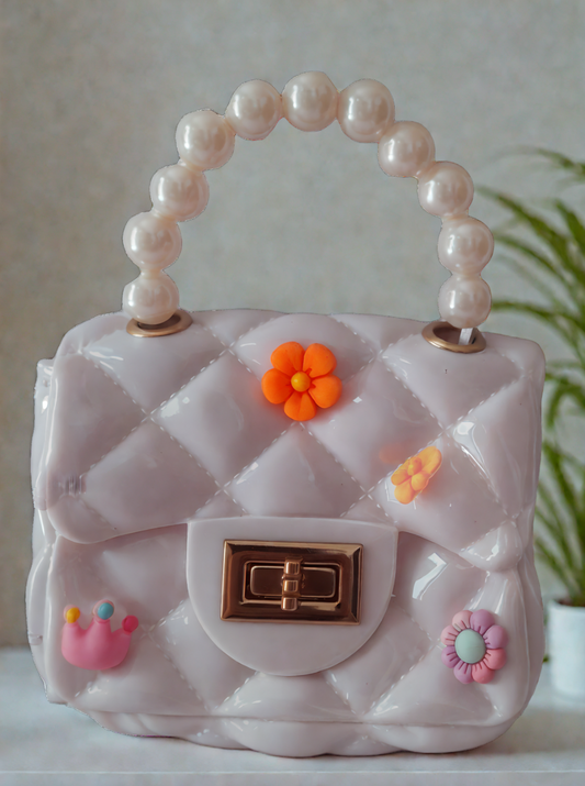 Silicon pearl sling bag with golden chain strap and pearl handle – stylish and durable mini shoulder bag for girls and women in white, available online in India.

