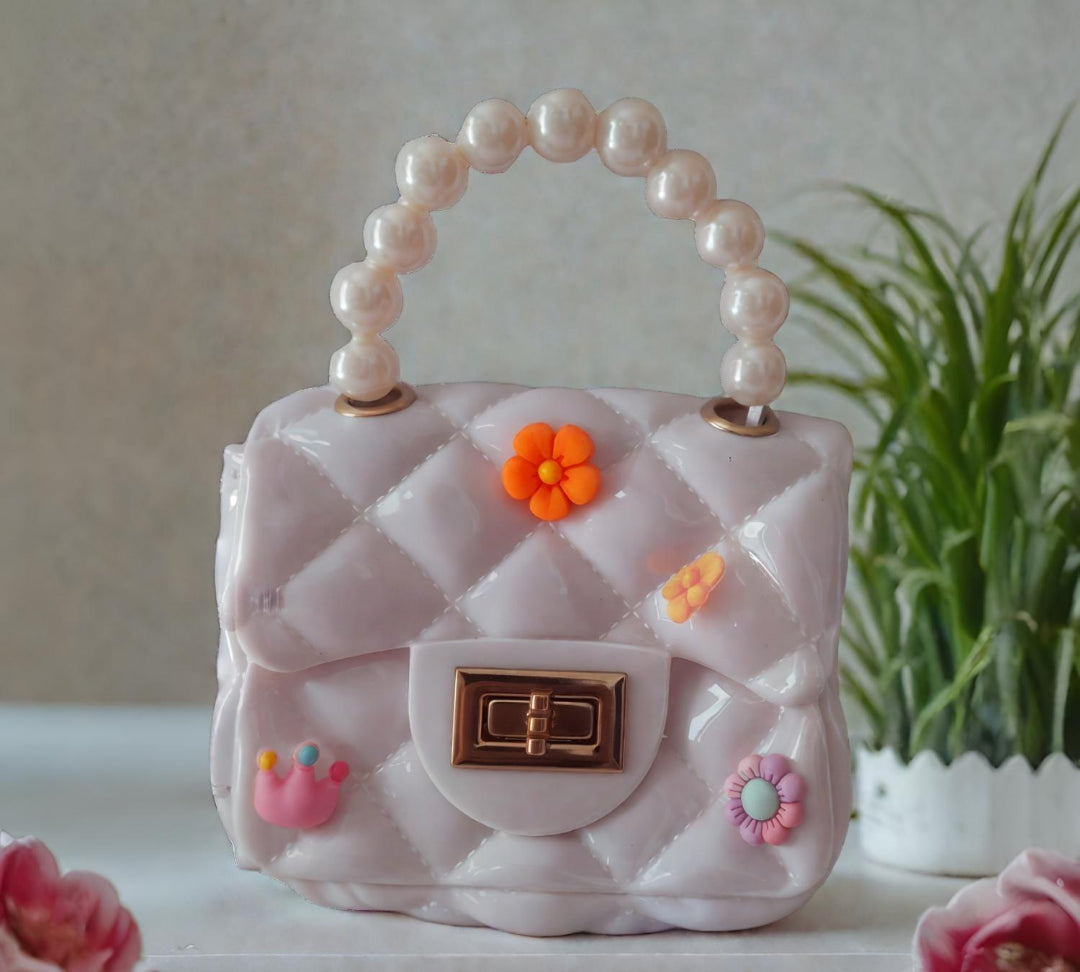 Silicon pearl sling bag with golden chain strap and pearl handle – stylish and durable mini shoulder bag for girls and women in white, available online in India.
